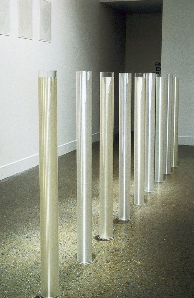 After Rain, 1992. Perspex, fishing line, 9 cylinders each 100 x 10 cm, installation view Monash University Gallery